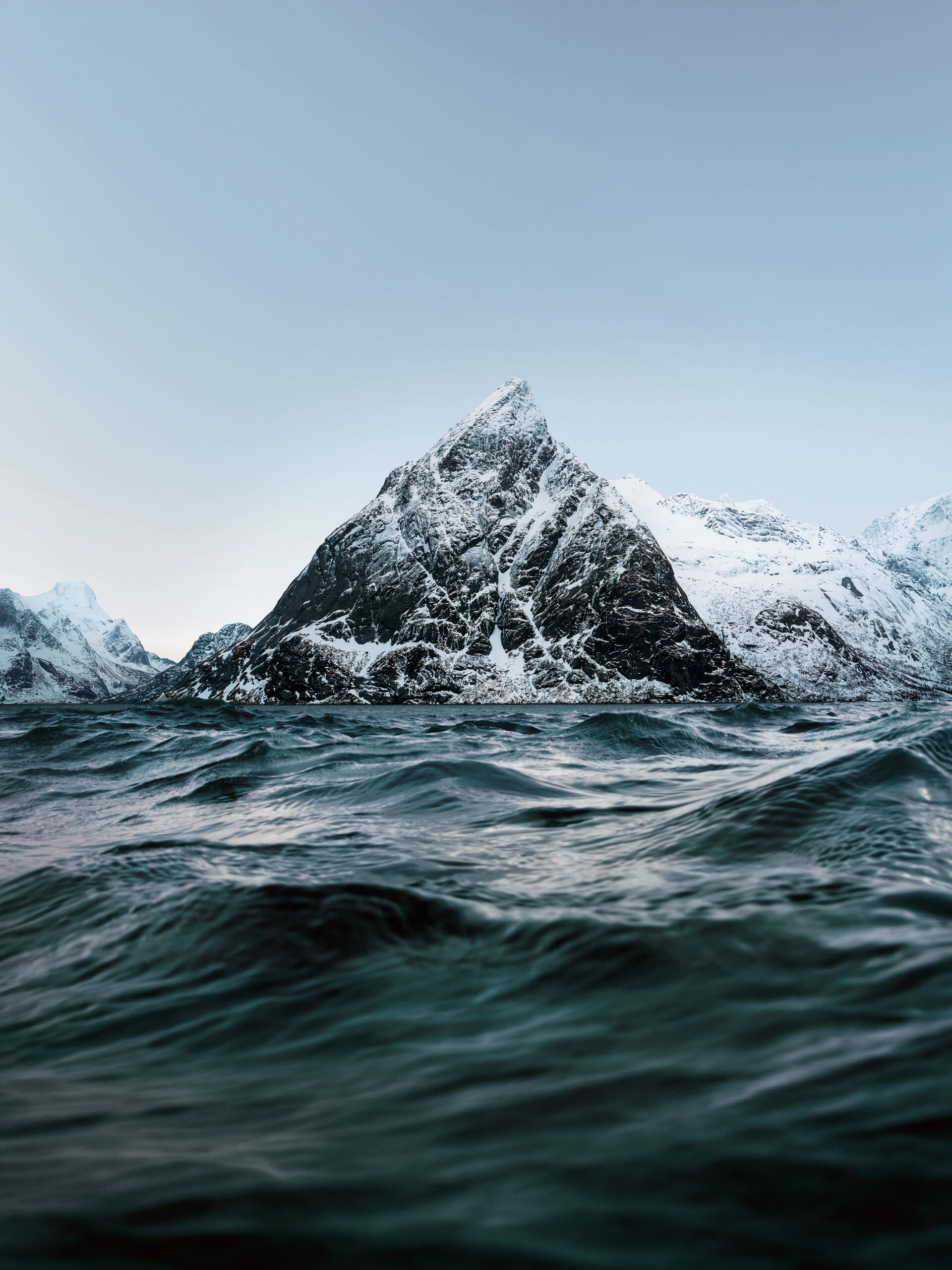 Snowy mountain peaks rising from the sea in lofoten islands, norway; Shutterstock ID 2553415891; purchase_order: Landskapsbilder Seacoll; job: Seacoll/Seagarden Visuell Identitet; client: Seagarden; other: